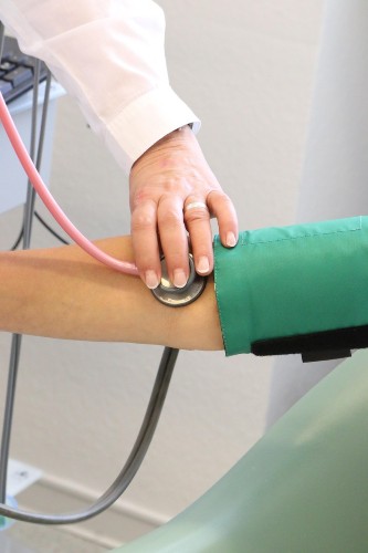 doctor checking bp