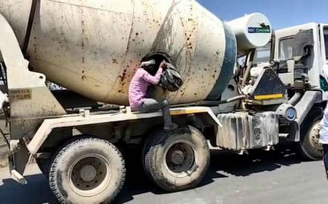 corona migrant workers in concrete mixer